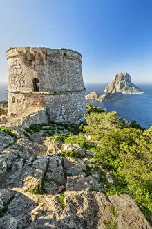 Images Dated 30th March 2020: Torre des Savinar defence tower with Es Vedra island in the background, Ibiza