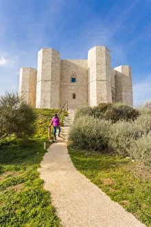 Architectures Prints: Tourist admiring Castel del Monte fortress in Andria, Apulia region, Italy (MR)