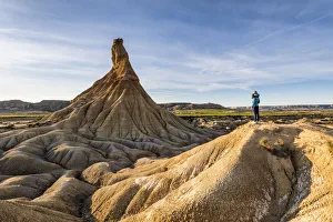 Admiring Gallery: A tourist admiring Castildetierra at sunset