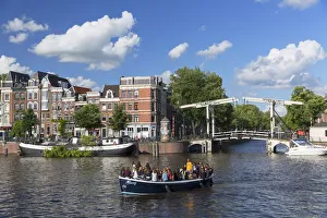 West European Prints: Tourist boat on Amstel River, Amsterdam, Netherlands