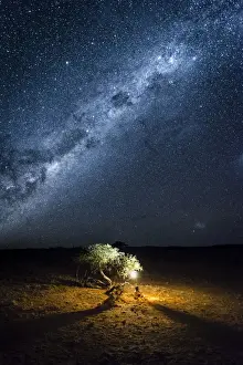 Tourist camping outdoor admiring the stars of the Southern Hemisphere, Namibia, Africa