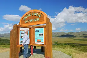 Northern Canada Prints: Tourist on the Dempster Highway (KM 405) at the Arctic Circle (model released)