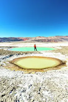 Salt Pond Prints: Tourist on the edge of colorful lagoons