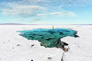 Salt Pond Prints: Tourist exploring salt flats, Salinas Grandes, Jujuy, Argentina. (MR)