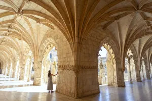 Admiring Gallery: A tourist observes the columns of the cloister of the Mosteiro dos Jeronimos (Jeronimos Monastery)