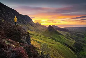 Model Released Prints: Tourist observes mountains and sunrise from Quiraing viewpoint