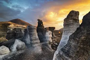 Las Palmas Prints: A tourist observes sunrise at Stratified city in Lanzarote