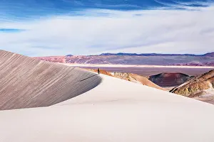 Walk Prints: Tourist standing on whIte pumice dunes