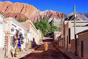 Walk Prints: Tourist walking in Purmamarca, Jujuy, Quebrada de Humahuaca, Argentina. (MR)