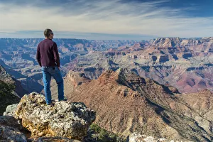 A tourist watching over Grand Canyon from Lipan Point, Grand Canyon National Park A tourist watching over Grand Canyon from Lipan Point, Grand Canyon National Park
