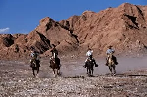 Action Sport Gallery: Tourists horse riding amongst the wind-eroded peaks