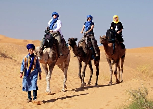Tourists riding camels, Erg Chebbi, Sahara Desert, near Merzouga, Morocco
