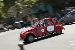 Citroen Prints: Tourists taking a tour of Paris in an old Citroen car with a retractable roof
