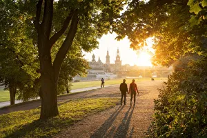Saxony Prints: Tourists walk along the Elbe riverside in Dresden, Saxony, Germany