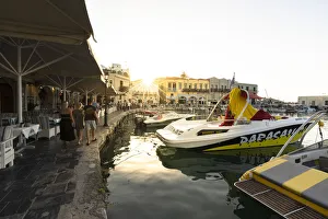 Rethymnon Gallery: Tourists walking on waterfront at sunset in the old Venetian harbour of Rethymno, Crete island