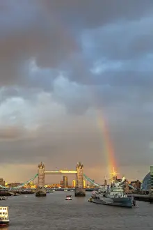 River Bank Prints: Tower Bridge and HMS Belfast from London Bridge at sunset with rainbow, London