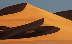 Sossusvlei Prints: Towering orange sand dunes and blue sky