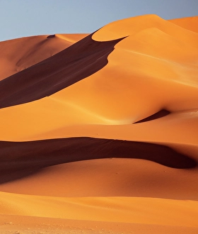 Sossusvlei Prints: Towering orange sand dunes and blue sky