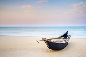 Vietnam Gallery: Traditional bamboo basket fishing boat on the beach at sunset, Thuan An Beach, Phu Vang District