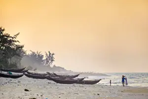 Traditional bamboo basket fishing boats on the beach at sunset, Thuan An Beach, Phu