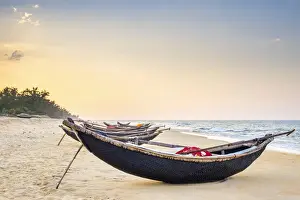 Copy Space Prints: Traditional bamboo basket fishing boats on the beach at sunset, Thuan An Beach, Phu