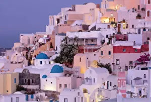 Edge Prints: Traditional blue domed churches and whitewashed houses spilling down the edge of the caldera