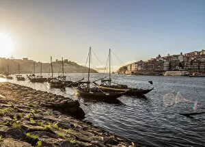 Images Dated 7th March 2019: Traditional boats on Vila Nova de Gaia bank of Douro River, Porto Skyline in the