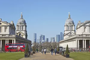 Images Dated 21st June 2022: A traditional double-decker red bus passing by the Greenwich University at the Old Royal Naval