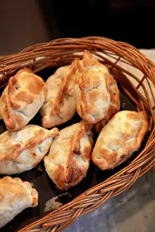 Buenos Aires Prints: Traditional empanadas on sale in a stand of the San Telmo Market (Spanish: Mercado de San Telmo)