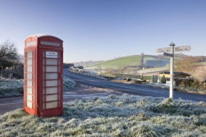 Traditional English telephone box in the frost at Stockleigh Pomeroy, Devon, England