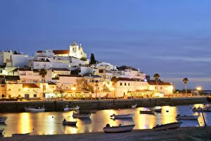 Images Dated 12th February 2018: The traditional fishing village of Ferragudo at dusk, bordering the Arade river. Algarve