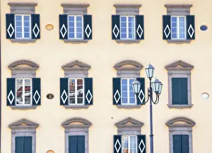 Arno Prints: Traditional house decorated with Pisa symbol on the bank of Arno River, Pisa, Tuscany