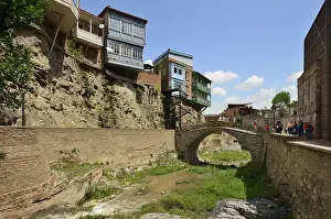 Tiflis Prints: Traditional houses on a cliff. Dzveli Sulphur Waterfall. Tbilisi, Georgia. Caucasus