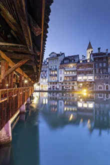 Traditional houses are reflected in the Aare river. Thun, Canton of Bern, Switzerland