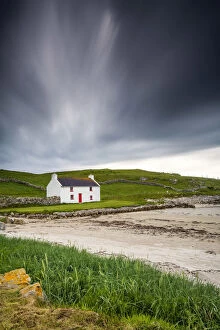 Storm Clouds Collection: Traditional Irish Cottage on a Beach, County Donegal, Ireland