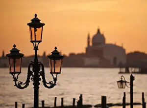 Poles Prints: Traditional lamps and The Chiesa del Santissimo Redentore at sunset, Venice, Veneto