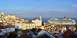Images Dated 2nd December 2016: The traditional and moorish Alfama district and a cruise ship on the Tagus river. Lisbon