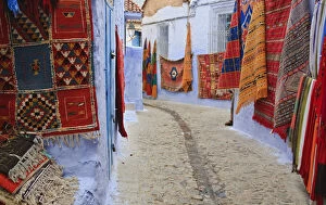 Wall Gallery: Traditional Moroccan rugs and fabrics on display, Chefchaouen, Morocco