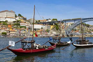 Images Dated 10th January 2019: Traditional Rabelo boat designed to carry wine down Douro river with city skyline behind