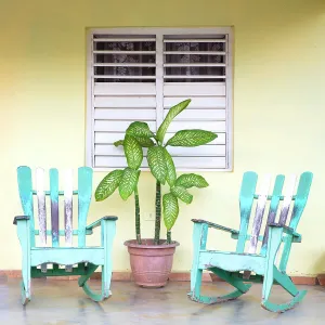 Porch Prints: Traditional rocking chairs on the front porch of a house in Vinales