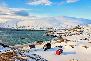 Finnmark Prints: Traditional rorbu cabins on a beach covered with snow