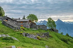 Valchiavenna Prints: Traditional stone huts with high peak Pizzo di Prata in background, Alpe Buglio