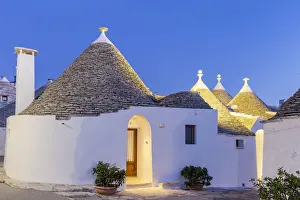 Itria Valley Prints: Traditional trullo house at dusk. Unesco World Heritage Site, Alberobello
