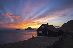 Turfed Roof Prints: A traditional turf house and a spectacular sunset in Velbastaður