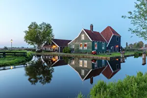 Zaanse Schans Prints: Traditional wooden houses reflected in a canal, Zaanse Schans, North Holland, Netherlands