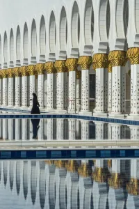 Mughal Prints: Traditionally Middle Eastern dressed woman walking in the Sheikh Zayed Mosque, Abu Dhabi