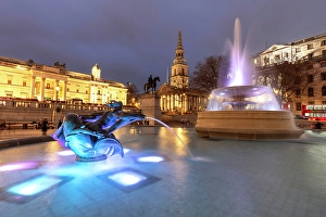 Fountains Prints: Trafalgar Square illuminated at night at Christmas, London, England, UK