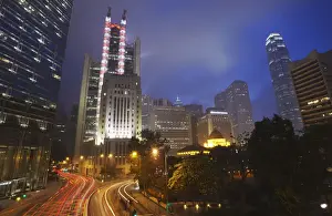 Hsbc Building Prints: Traffic passing along Queens Road Central at dusk with HSBC building in background