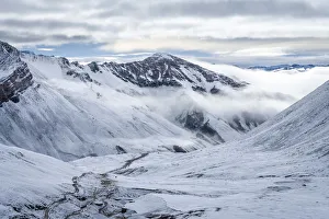 Trail leading through snow covered valley during winter to Rainbow Mountain, Uchullujllo Trail leading through snow covered valley during winter to Rainbow Mountain, Uchullujllo