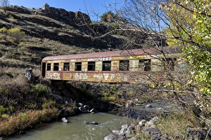 Crossing Prints: A train carriage used as a bridge to cross a river